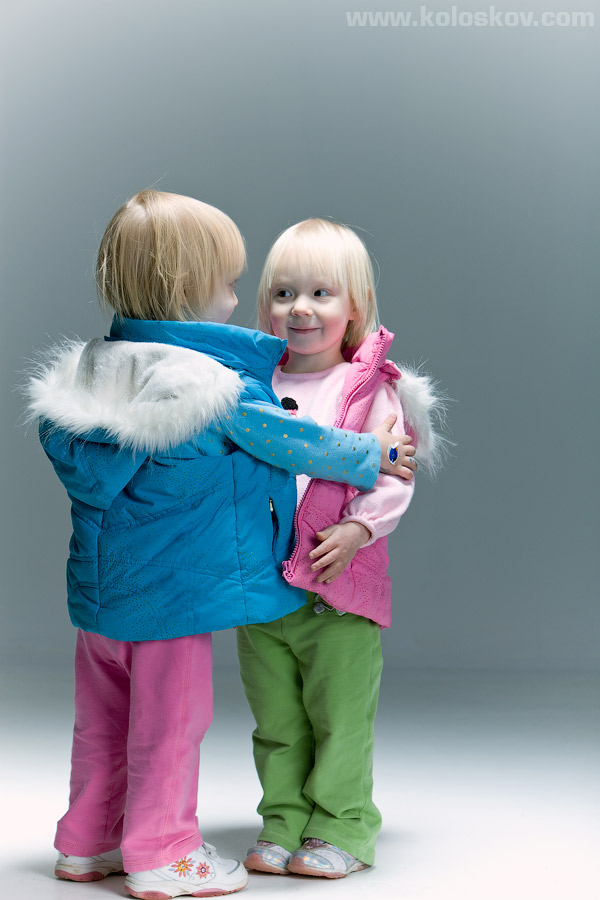 Twin toddlers studio portrait